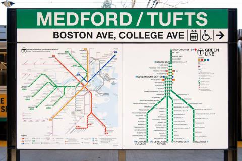 Signs showing the name of the Medford/Tufts University green line station