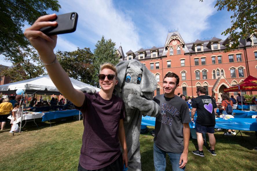 Students take pictures with Jumbo at Community Day on September 22, 2019. 