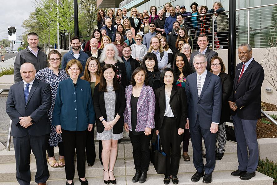 TCG recipients gather for a photo on the steps of the Joyce Cummings Center in May of 2023