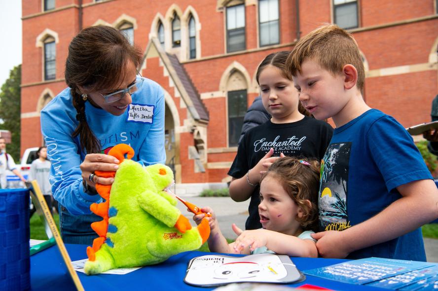 Tufts University School of Dental Medicine hosts a resource table at Tufts Community Day.