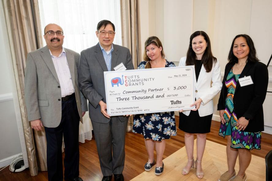 Representatives from Josiah Quincy Upper School in Boston receive a Tufts Community Grant award at the Tufts Community Grants reception in June of 2024. 