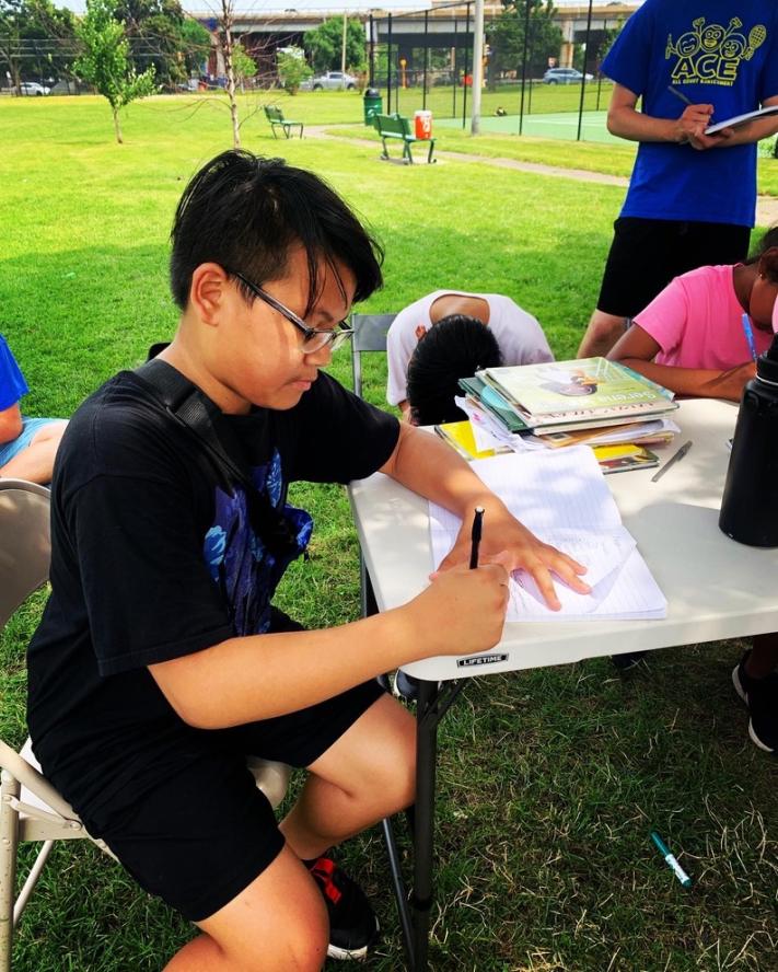 An ACE camper participating in the writing program