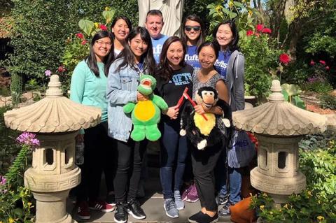 Members of Tufts University School of Dental Medicine’s Asian Dental Organization pose in a garden