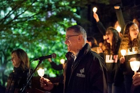 President Monaco salutes alumni and members of the Class of 2019 during the annual Commencement Eve illumination ceremony on May 18, 2019.