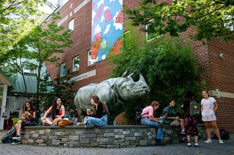 tudents eat lunch near Rosie the Rhino in the courtyard of the SMFA