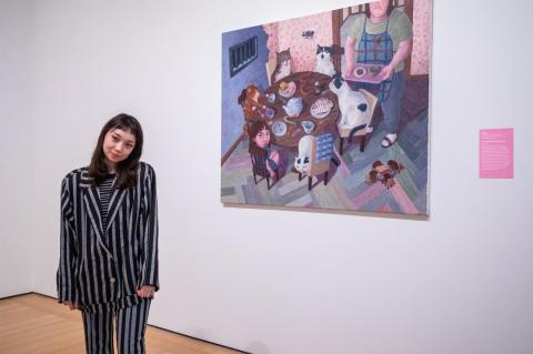 Rei Xiao with her painting &quot;It was dark inside the wolf.&quot;