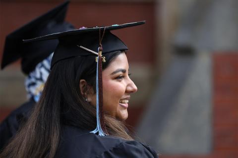 a graduate in profile, smiling