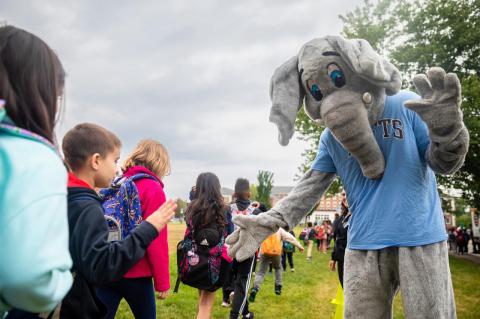 Winter Hill students pass Jumbo the mascot as they enter Olin Hall. 
