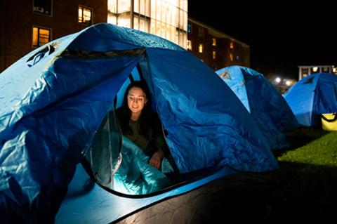 Emilia Rosinski, A24, sets up in a tent the night of a Sleep Out on the Res Quad at Tufts University.