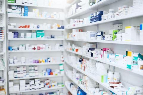 White shelves at a pharmacy filled with prescription medication